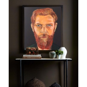Red Flame oil painting displayed in a modern interior, showcasing the bold portrait of a red-haired Irish man