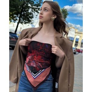 Woman wearing a vibrant Silk Satin scarf with cactus designs in bold colors by NEKOL