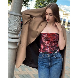 Woman wearing a vibrant Silk Satin scarf with cactus designs in bold colors by NEKOL