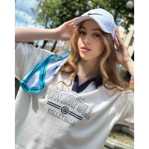 Blue butterfly silk scarf styled with casual outfit outdoors