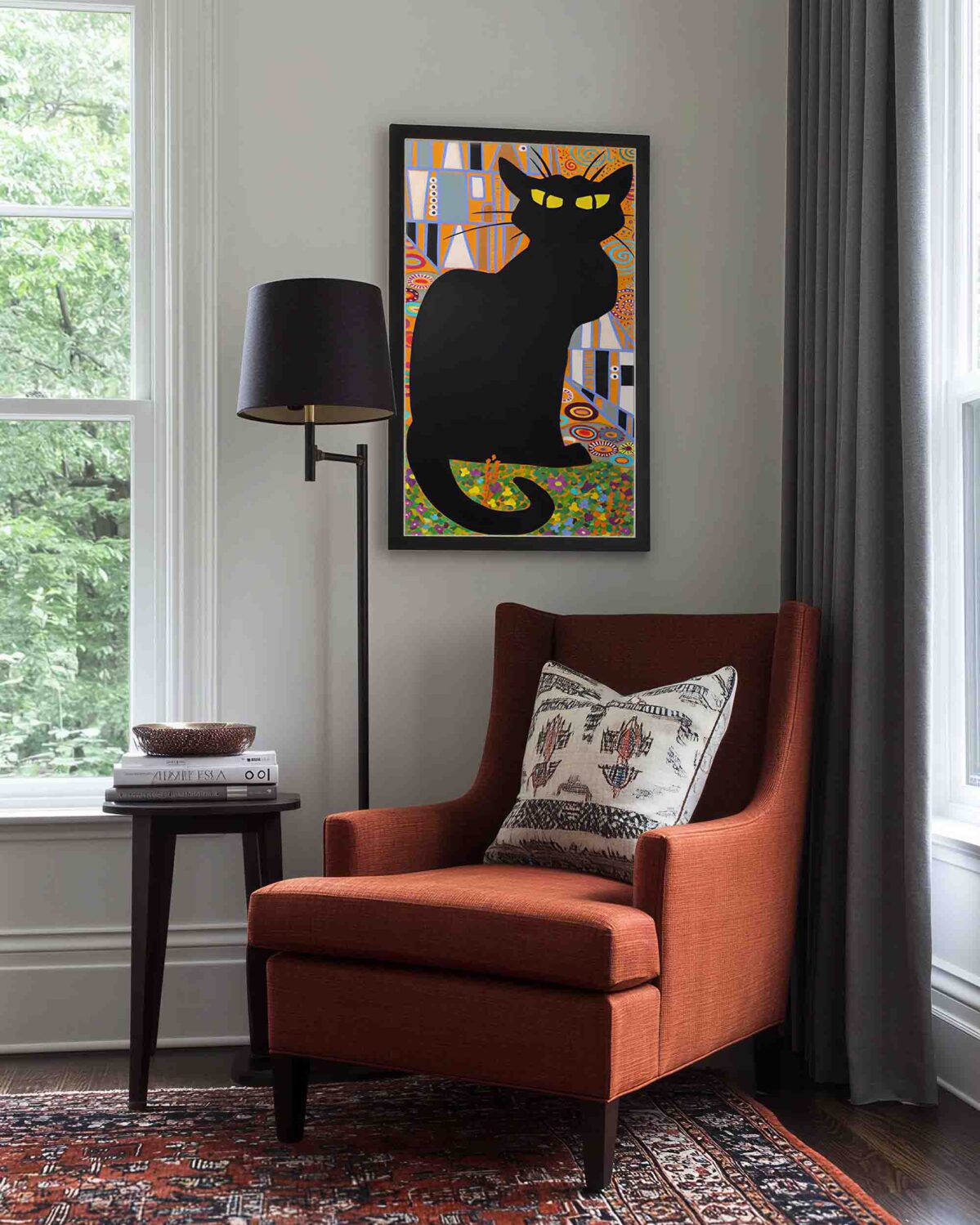 chat noir oil painting displayed in modern interior with armchair